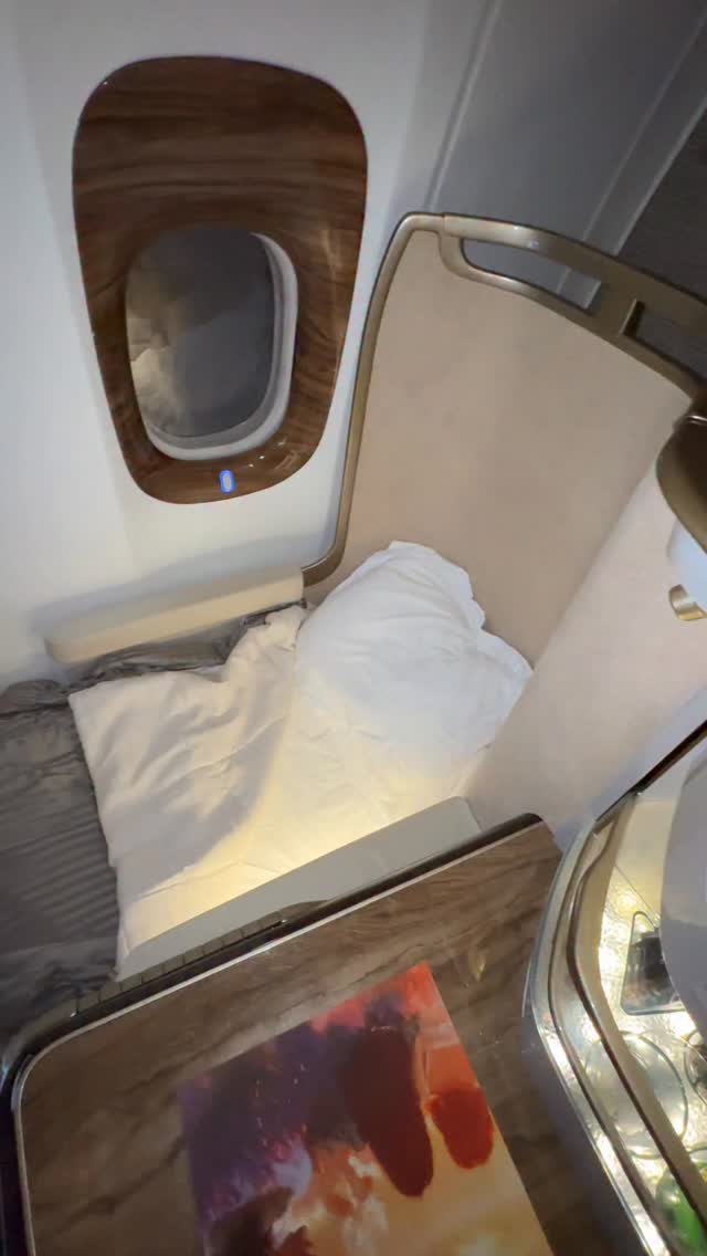 Instagram post by @luxurytravelexpert for Emirates. Caption reads: Stretching out at 40,000 feet never felt so....