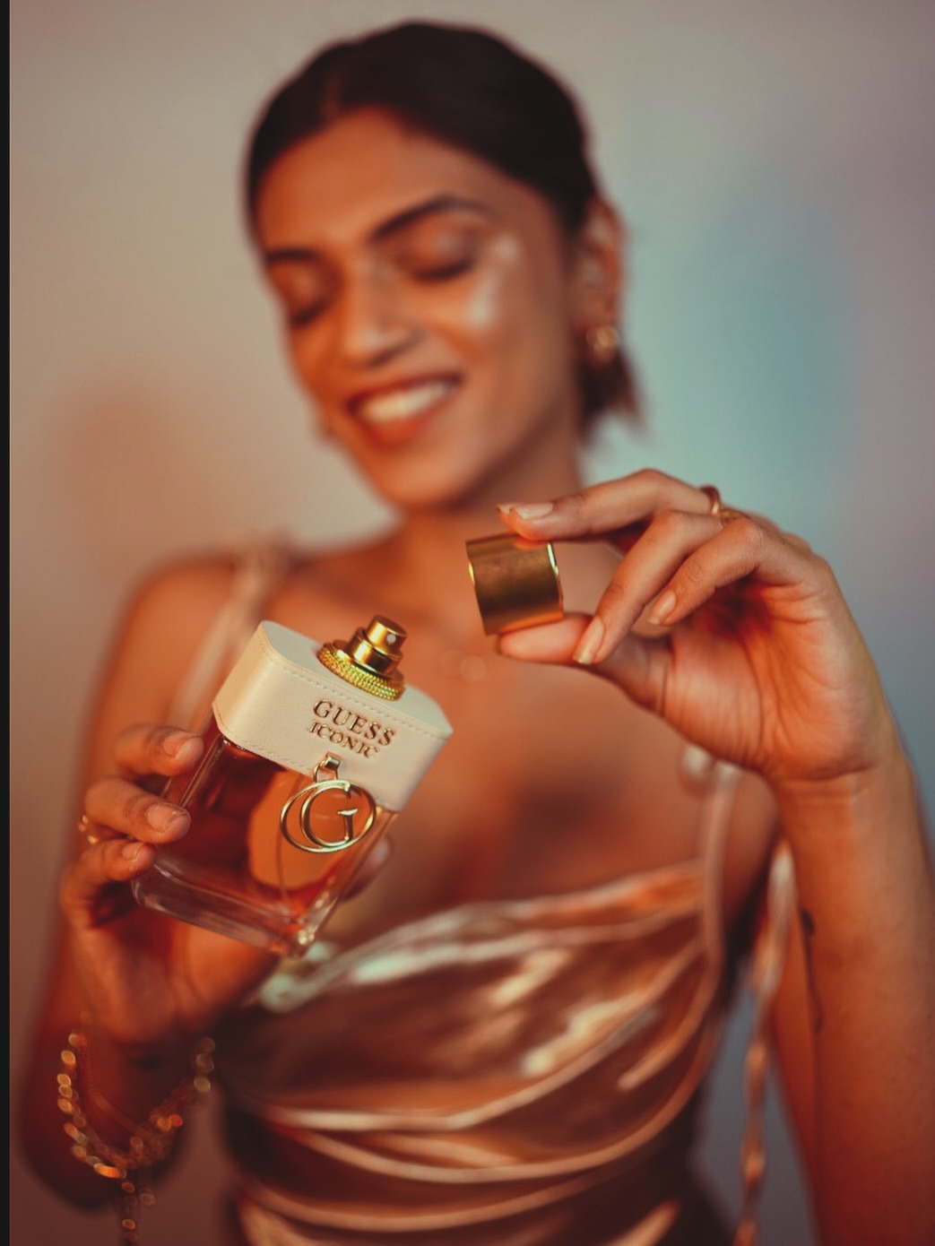 Instagram post by @tallforyou11 for GUESS. Caption reads: Who says perfumes are just for sunny days?.