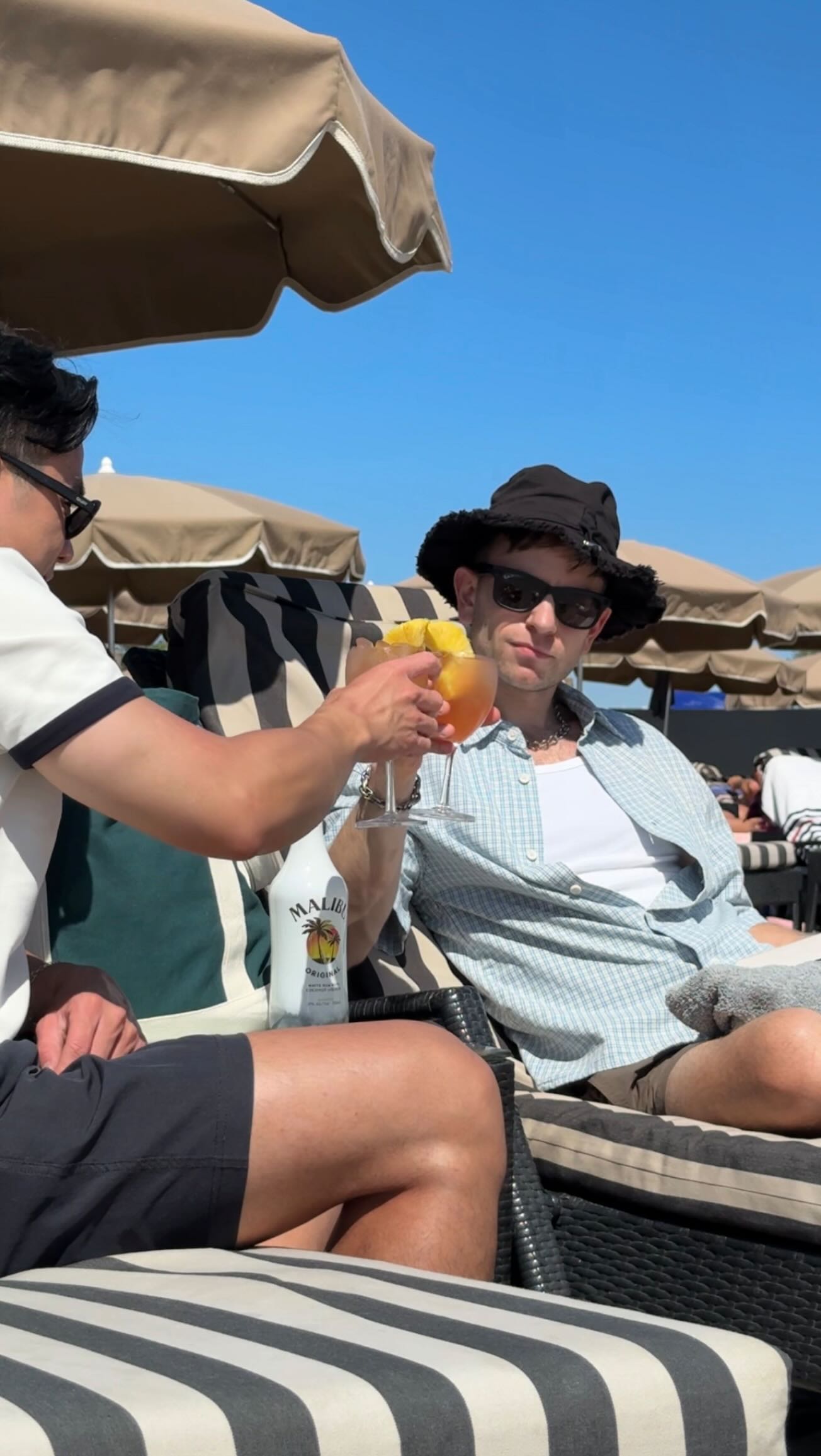 Instagram post by @pashagrozdov for Malibu Drinks. Caption reads: Every OOO deserves a @malibu_rum moment - always....