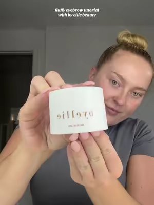 TikTok post by @oliviajohnsonx for byellie. Caption reads: fluffy eyebrow tutorial with @byelliebeauty ☁️....