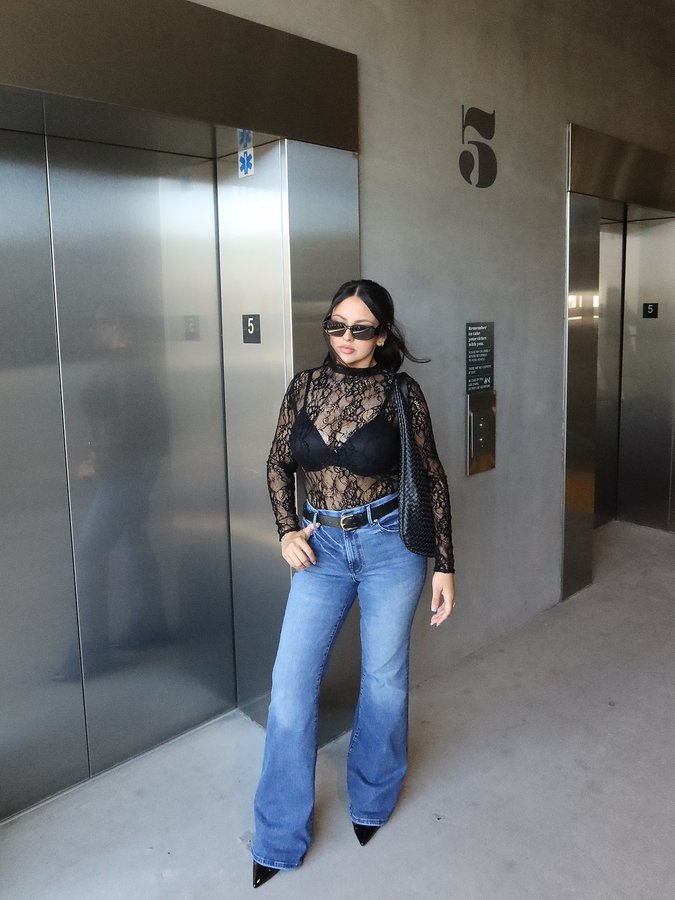 Instagram post by @jenn.salguerro for GOOD AMERICAN. Caption reads: ur cute jeans 🖤 Wearing the @goodamerican Always....