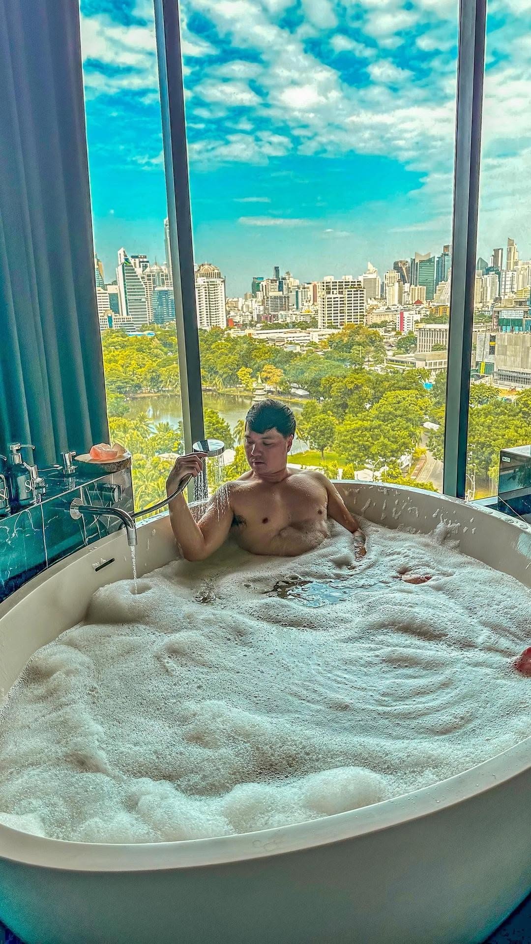 Instagram post by @travel_with_kdm for The Gay Passport. Caption reads: Back at it again! ✈️ First stop, Bangkok at....