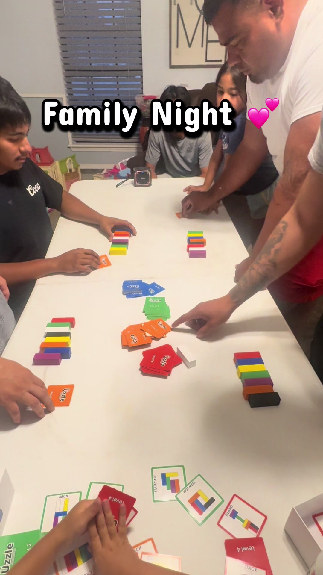 TikTok post by @carranza1914 for The Uzzle. Caption reads: [...] 😂 #uzzle #familyfun #familygames @The Uzzle.
