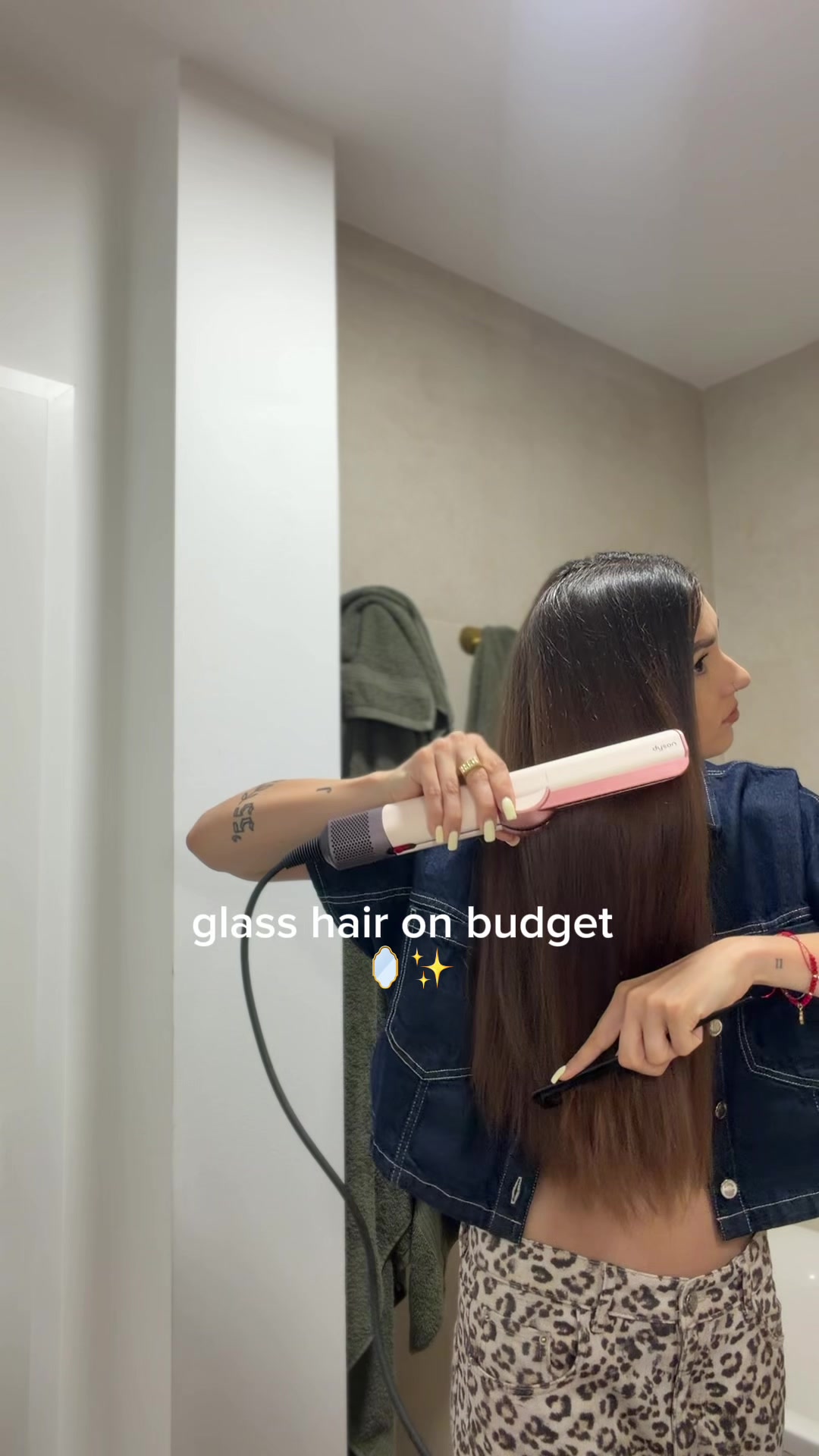 TikTok post by @thekajliss for Garnier CZ/SK. Caption reads: glass hair on budget🪞✨ = Diamond sleek spray🔝....