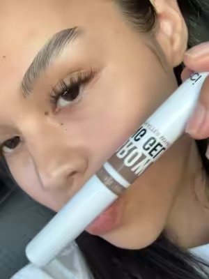 TikTok post by @delacruzmariely for HECI Beauty Makeup. Caption reads: [...] Laminated brows at home||@HECI Beauty Makeup.