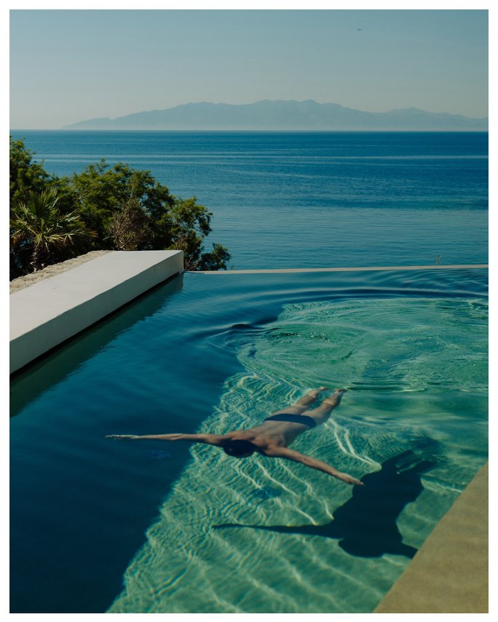 Instagram post by @julianimkephotography for Soho House. Caption reads: New work: Greek summer moments captured on Mykonos....