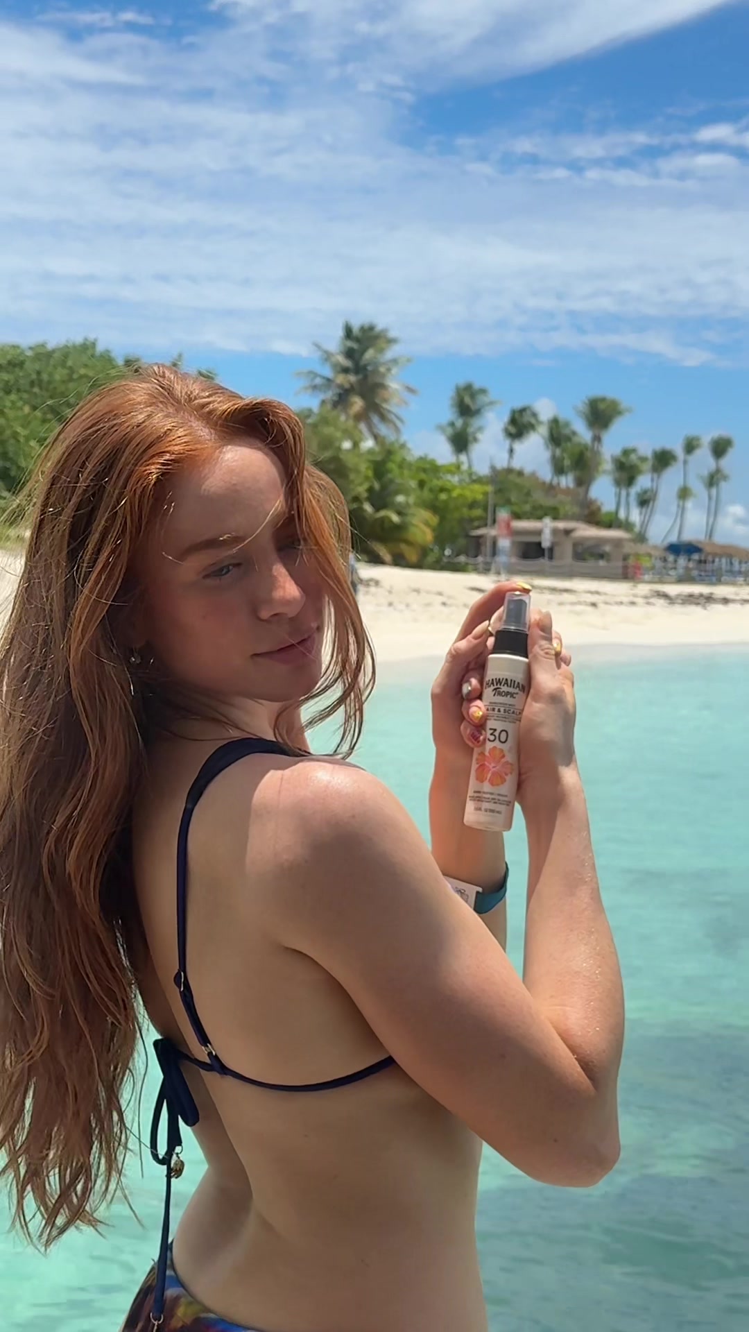 TikTok post by @achendricks for Hawaiian Tropic. Caption reads: [...] be using this all summer long 🌞 @Hawaiian....