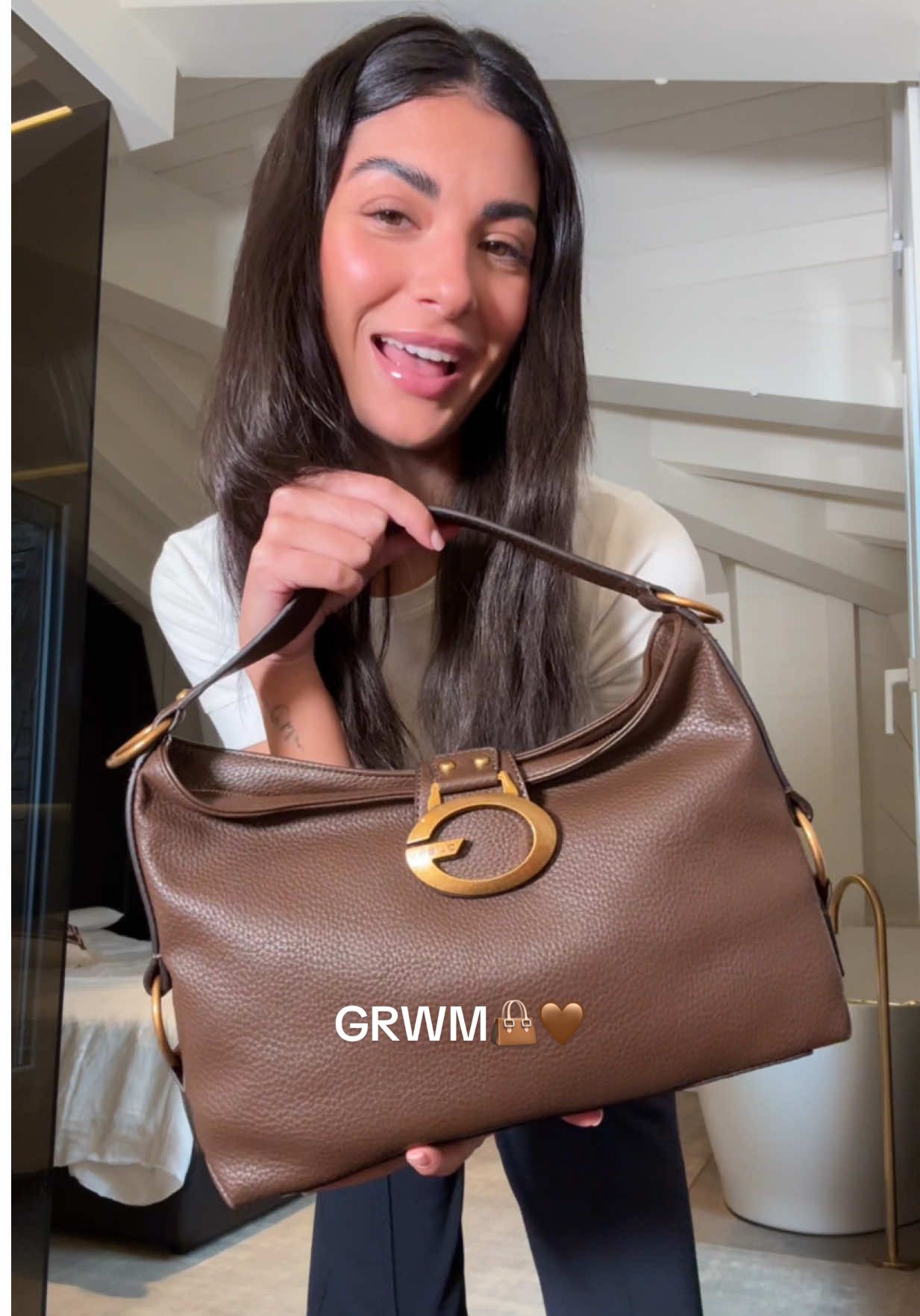 TikTok post by @majno for GUESS. Caption reads: My new look from @GUESS FW25 Collection with their....