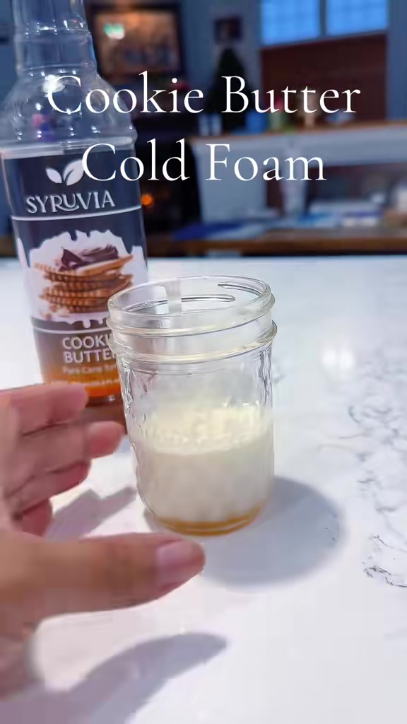 TikTok post by @chefmisscris for Syruvia. Caption reads: Easy cold foam recipe with @Syruvia cookie butter....