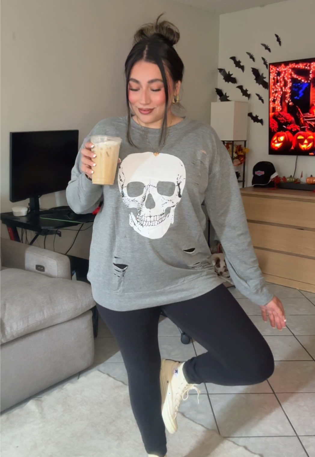 TikTok post by @yvetteeful for Jellywood. Caption reads: [...] or treat yourself to this sweater....