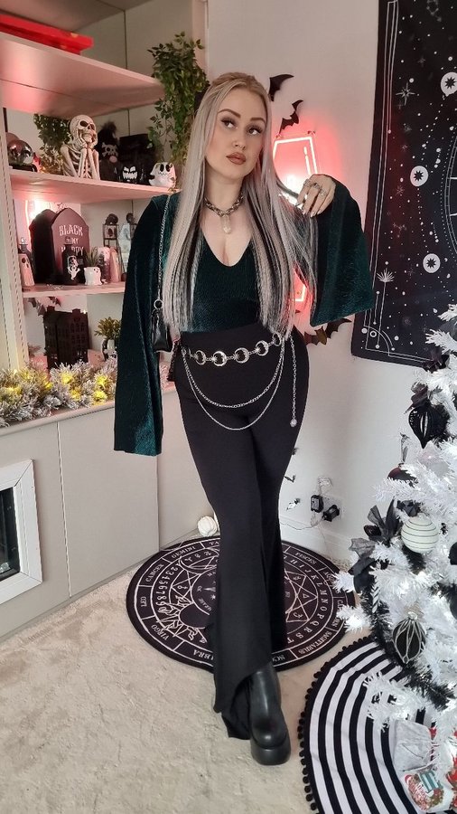 Instagram post by an influencer for BlackMilk Clothing. Caption reads: AD | Feeling festive in @blackmilkclothing Crinkle....