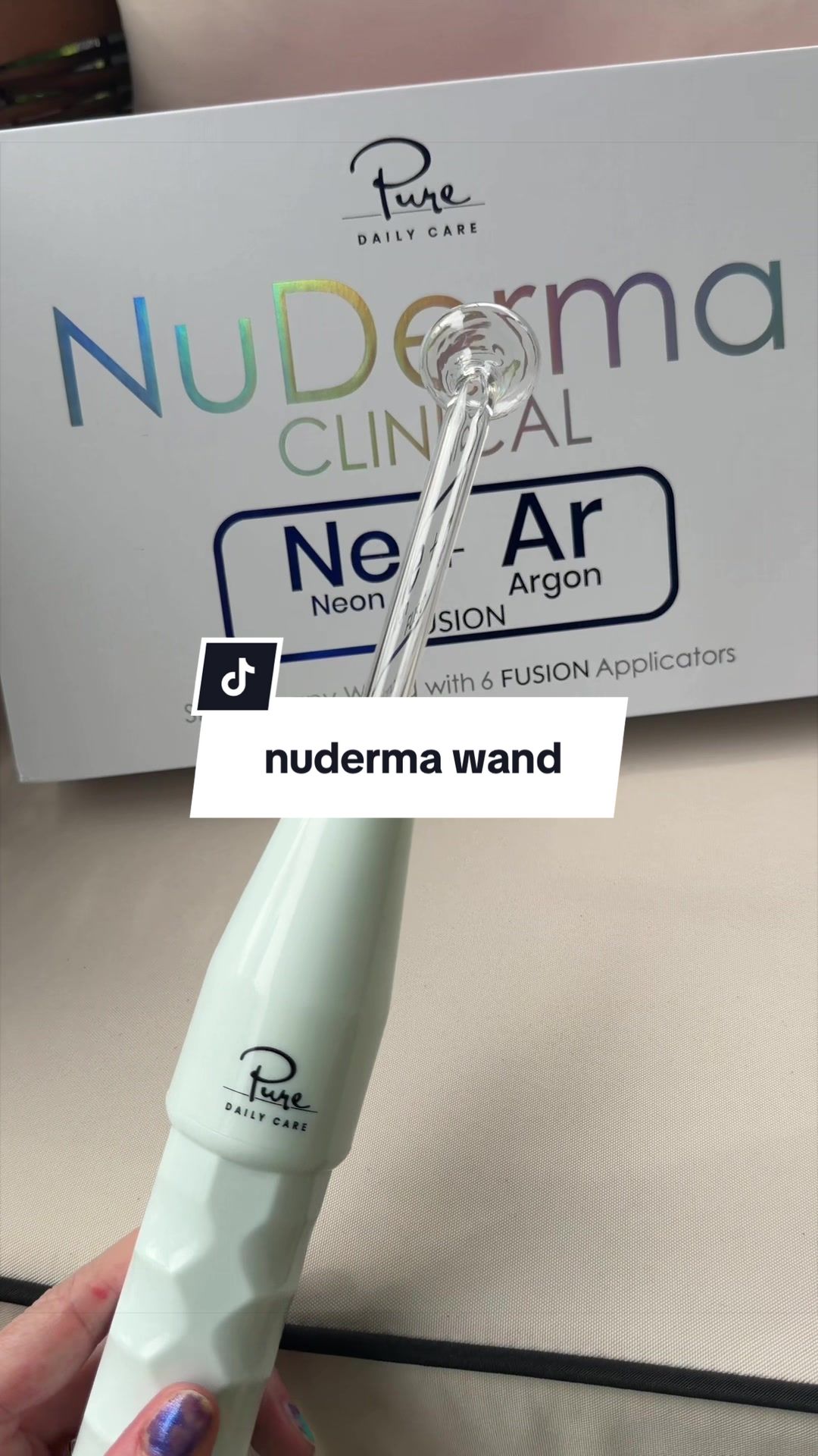 TikTok post by @meredith_marques for Pure Daily Care NuDerma Wand. Caption reads: @Pure Daily Care NuDerma Wand #nuderma....