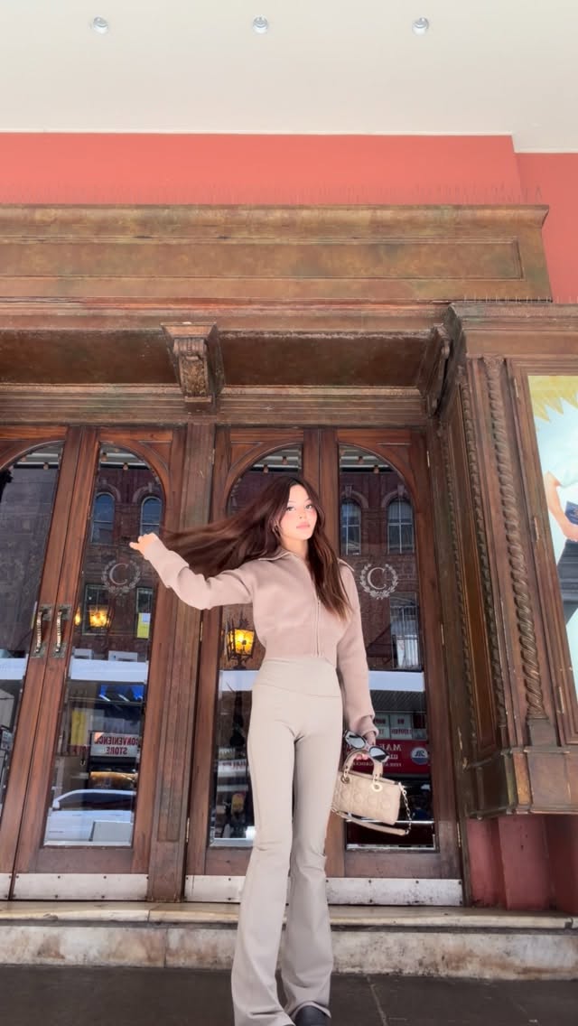 Instagram post by @lilymaymac for Alo Yoga. Caption reads: Quick fit check in the city 😋 @alo #aloPartner.
