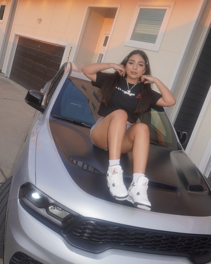 Instagram post by @itsqueennr_ for Dodge. Caption reads: [...] them my passenger playlist 🎶 👸 S/O To....