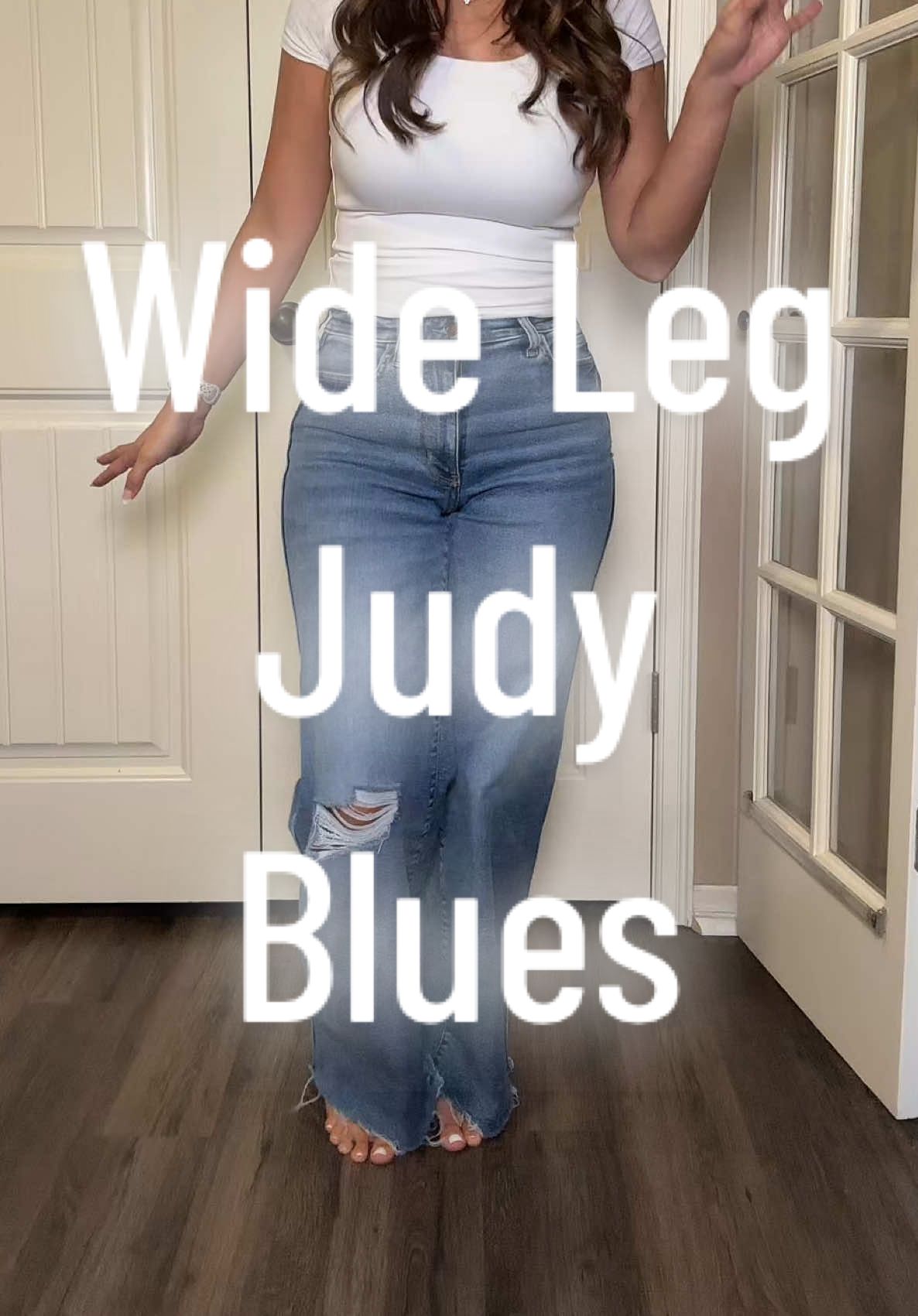 TikTok post by @shop.with.selena for Emma Lous Boutique. Caption reads: Size down one size!!! A pair of jeans that are....