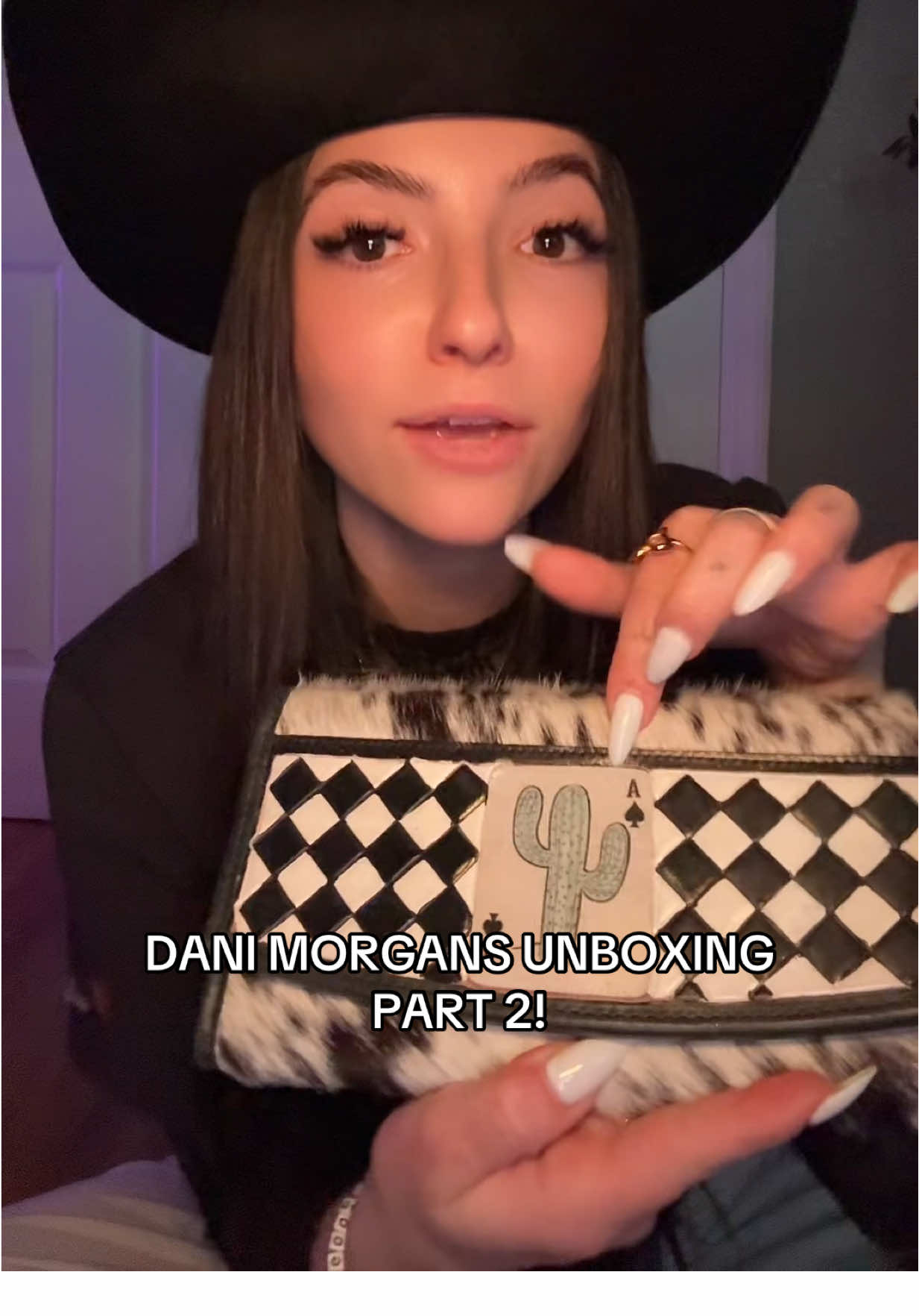 TikTok post by @lizabiam for Dani Morgans. Caption reads: Part 2 of Dani Morgans live unboxing !! IN LOVE....