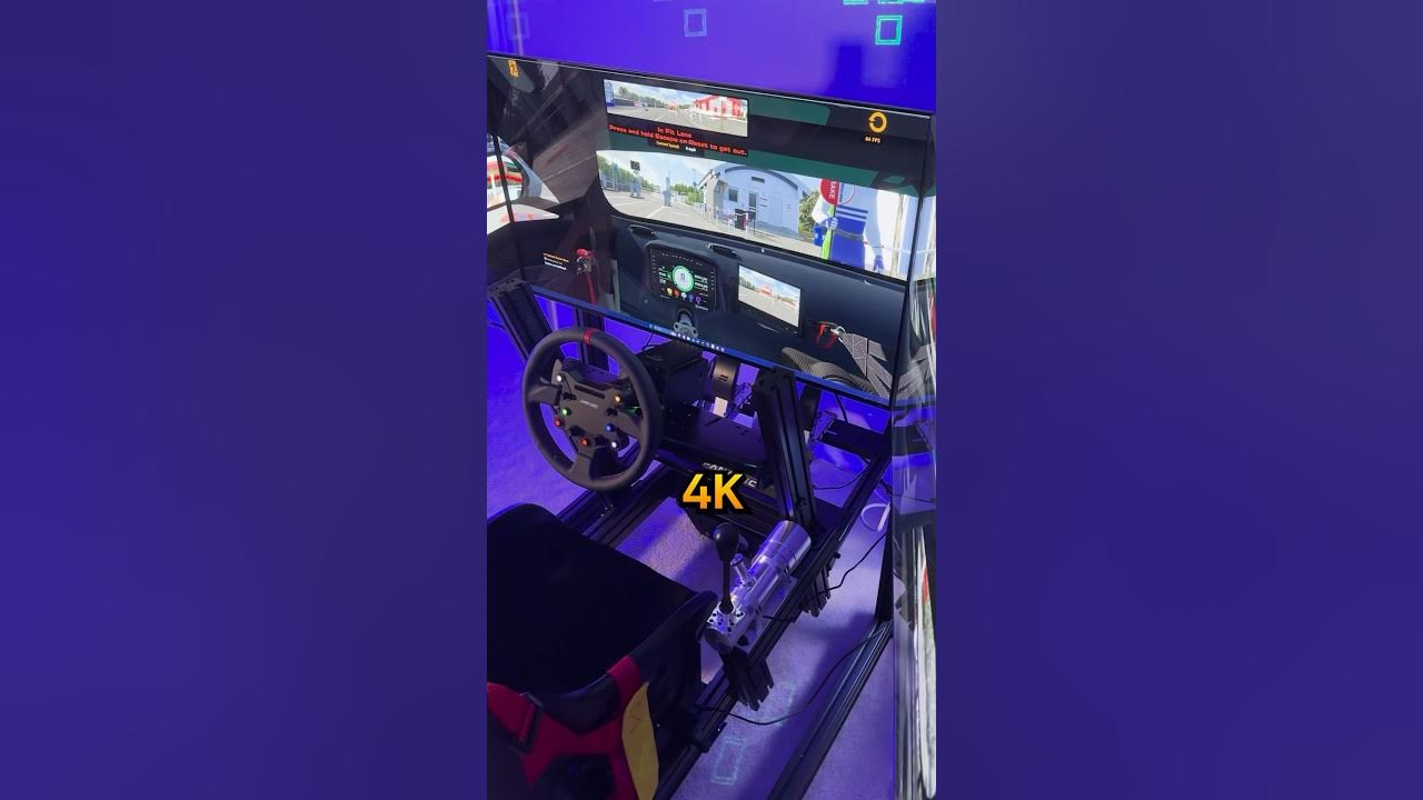 YouTube post by @OCRacing for Simagic. Caption reads: INSANE 2023 Sim Racing Setup Tour! #lgoledc3.