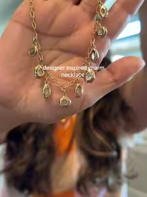 TikTok post by @melissuuuh for Ettika. Caption reads: This Liquid Crystal Charm Necklace from @Ettika is....