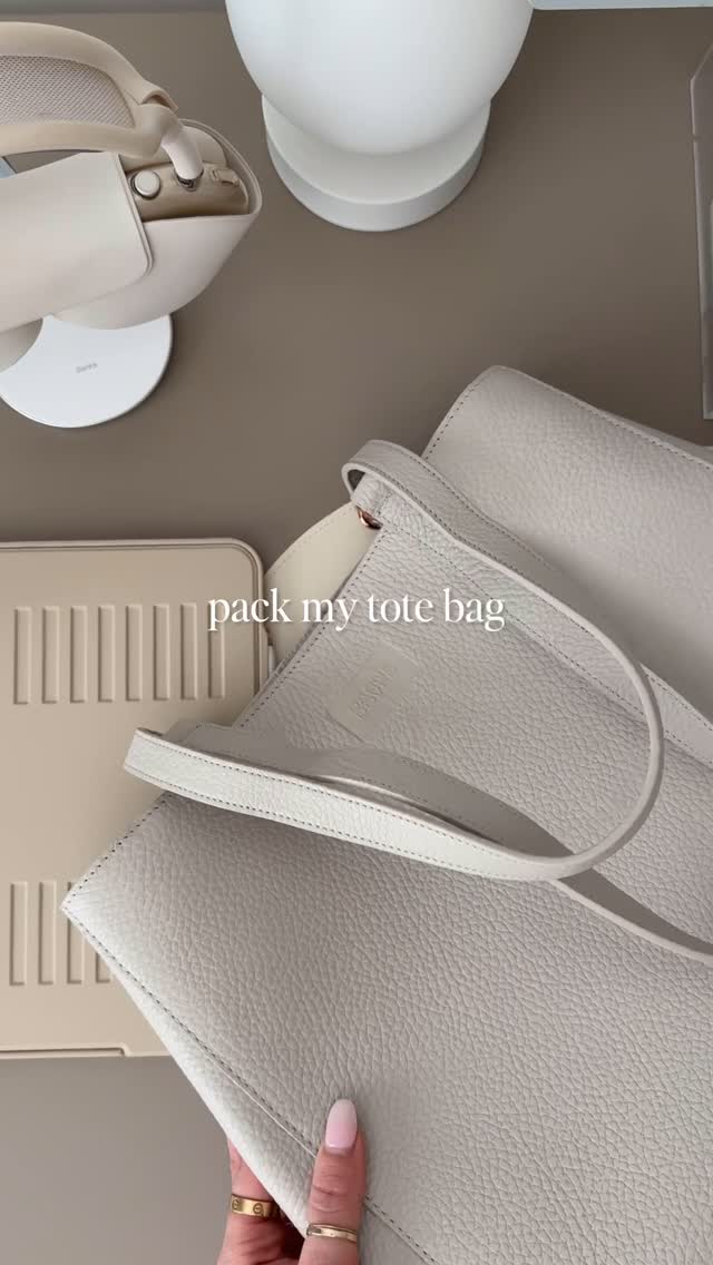 Instagram post by @alliemariedigital for Dagne Dover. Caption reads: Pack my tote bag with me! It feels so good to....