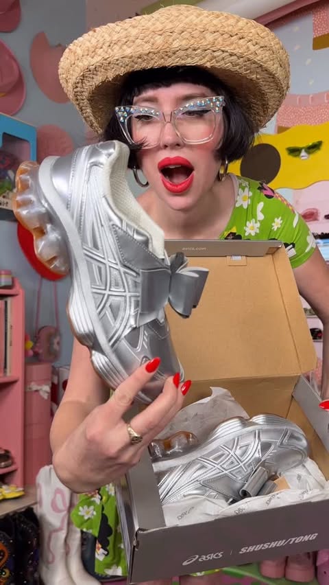 Instagram post by @afashionnerd for ASICS. Caption reads: My new silver bow tennis shoes by @asics x....