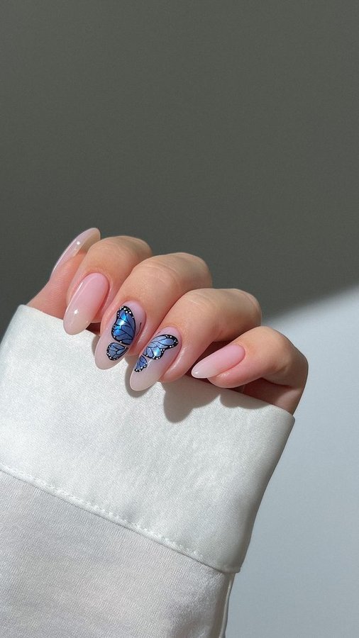 Instagram post by @heygreatnails for ICEGEL. Caption reads: 🦋✨ summer days call for glittery blue butterfly....