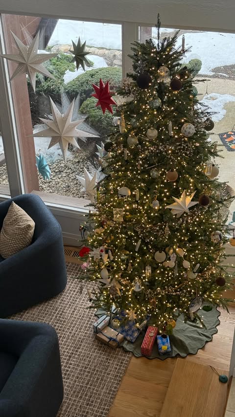 Instagram post by @perkinsonparkway for BISSELL. Caption reads: #ad Holiday movie night on a cream couch… I know.....