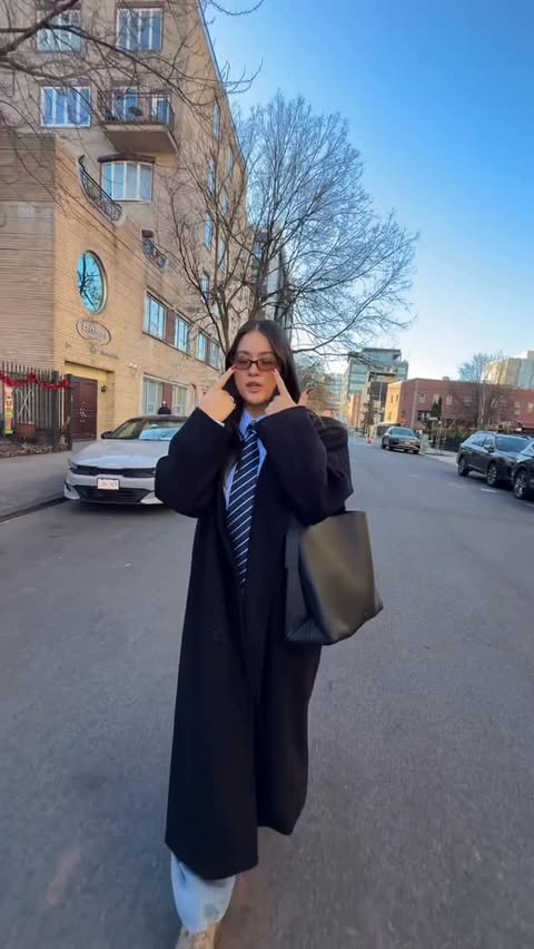 Instagram post by @caitlin.emiko for Status Anxiety. Caption reads: THE everything bag @status_anxiety code: EMIKO AD.
