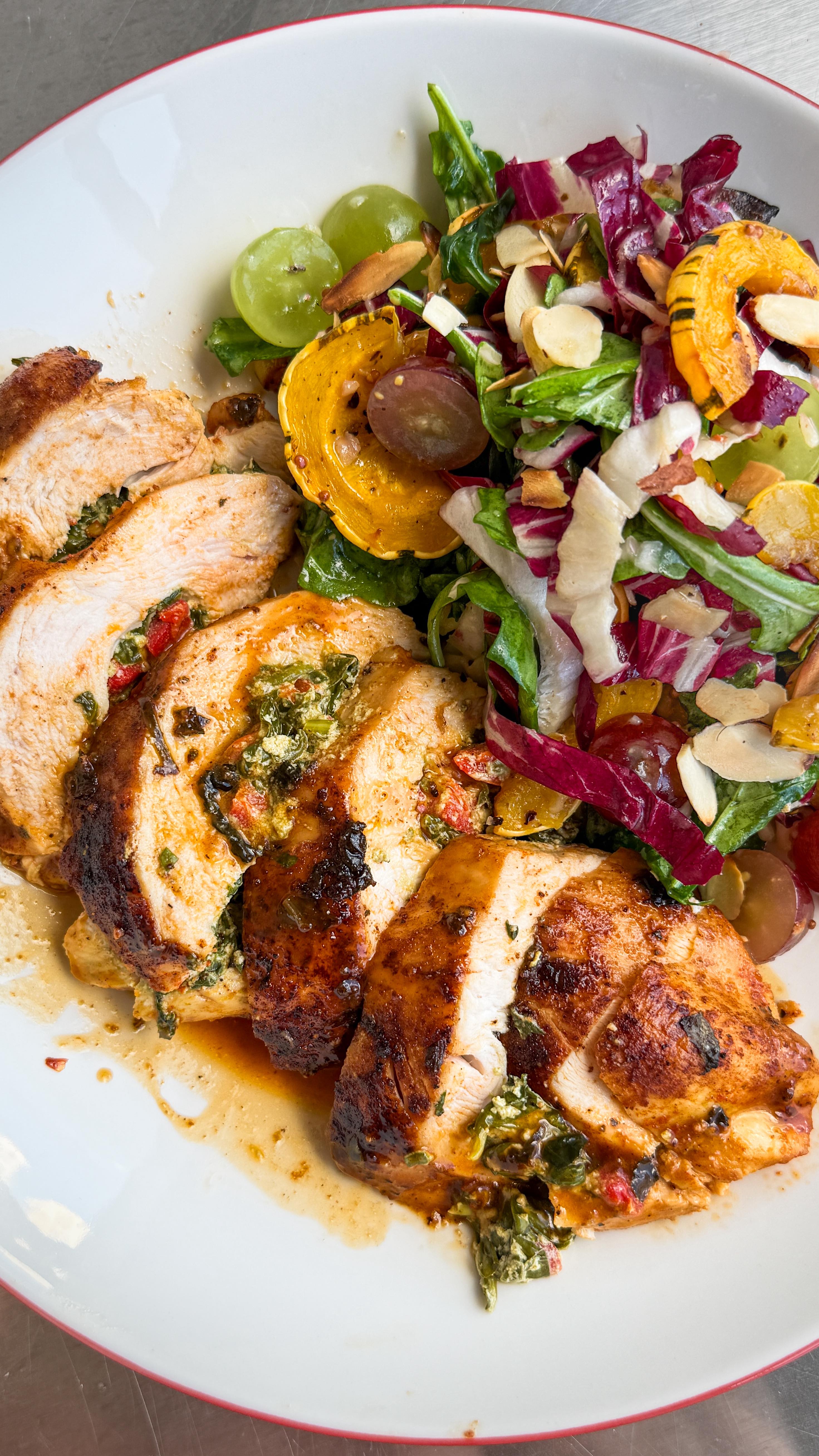 Instagram post by @primal_gourmet for Grapes from California. Caption reads: Tuscan Stuffed Chicken with California Grapes &....