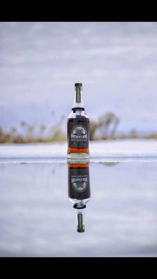 Instagram post by @whiskywithaview for Brother's Bond Bourbon. Caption reads: Reflection shoot for @brothersbondbourbon....