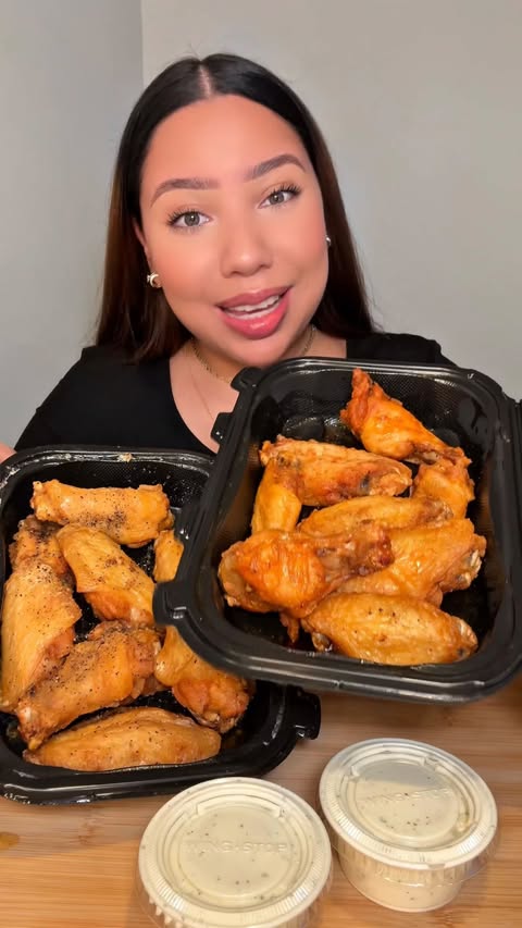 Instagram post by @claudiaeatsgood for Wingstop. Caption reads: @wingstop really said flavor AND protein 🤩🔥 the....