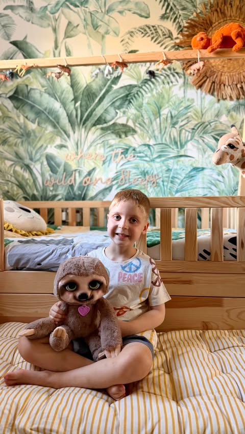 Instagram post by @erin.grace.b for Just Play. Caption reads: AD 🦥💚 Meet the newest resident of Finley’s....