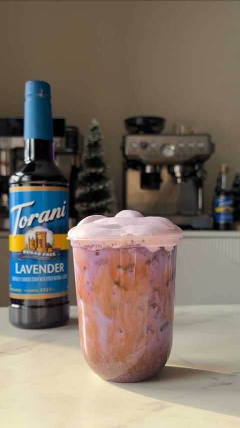 Instagram post by @coffeewithrafaela for Torani. Caption reads: Whipped Lavender Ube Oat Milk Latte💜✨
made with....
