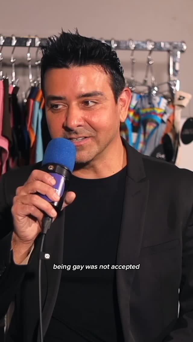 Instagram post by @julianswildinx for Andrew Christian. Caption reads: being gay back then vs now.. 🌈 new episode with....