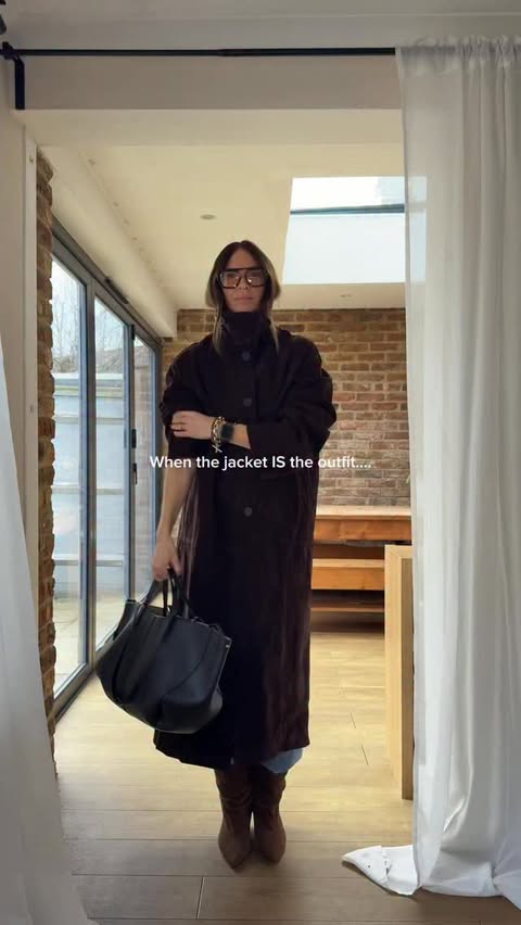 Instagram post by @keely_busby for John Lewis. Caption reads: Sometimes the jacket IS the outfit! 🤎
~Link in....