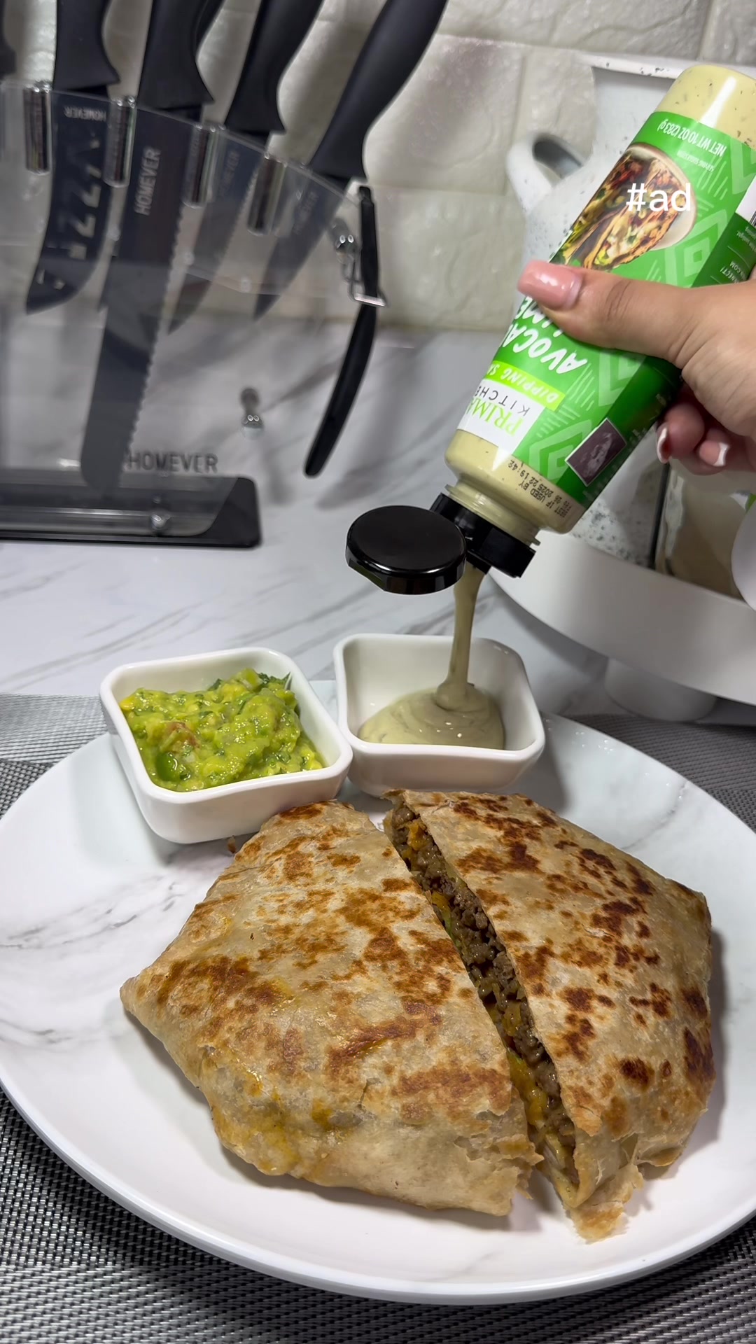 TikTok post by @cookwithnidi for Mark's Daily Apple. Caption reads: #ad Crunch wrap supreme w/ @Primal Kitchen Foods....