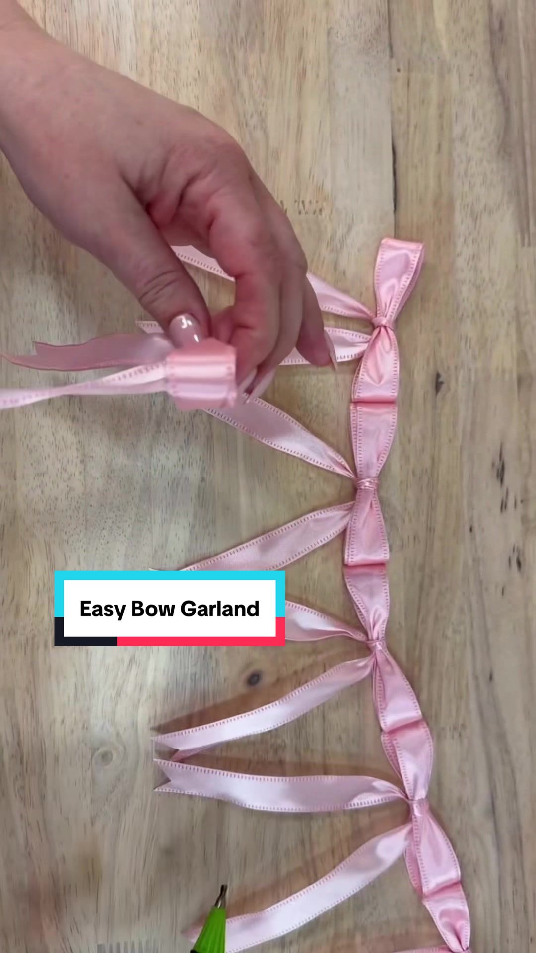 TikTok post by @julieswreathboutique for Hobby Lobby. Caption reads: [...] 💗 I grabbed pink wired ribbon from Hobby....