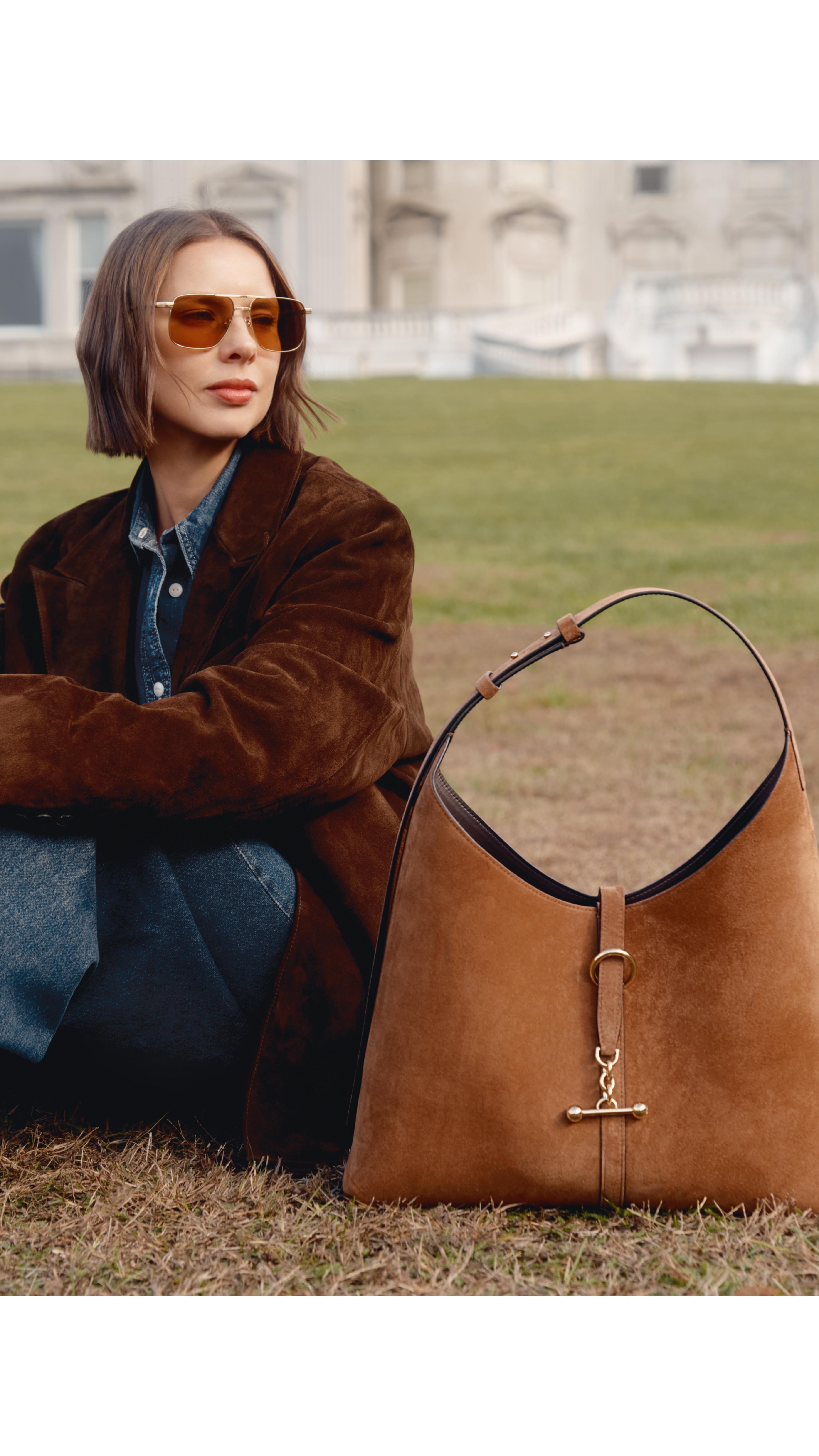 Instagram post by @marinaingvarsson for Strathberry. Caption reads: Always on the move, and this bag moves with me.....