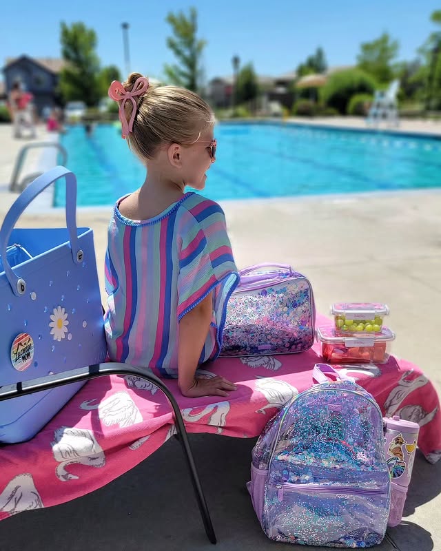 Instagram post by @therockymtnmomma for Packed Party. Caption reads: Pool day with @packedparty 💦 Their new collection....