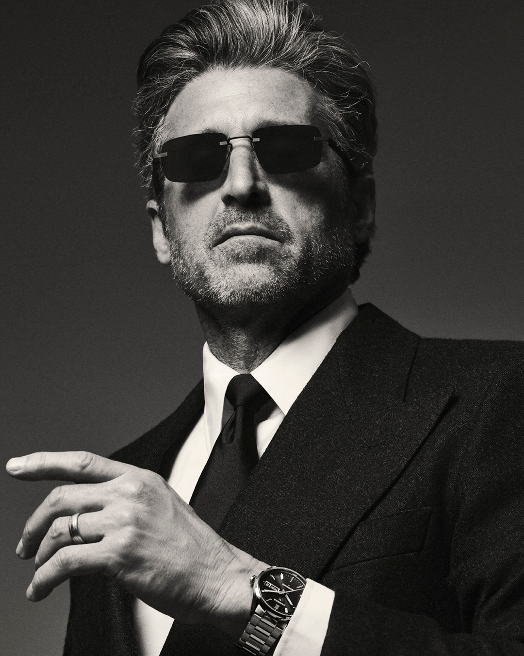 Instagram post by @patrickdempsey for TAG Heuer. Caption reads: House Ambassador Patrick Dempsey stands out in the....