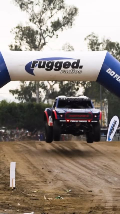 Instagram post by @realityfilm.co for Rugged Radios. Caption reads: The Rugged Wash was full of energy at the Baja....