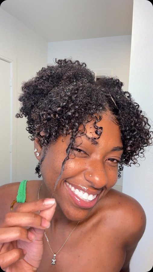 Instagram post by @ricaelaa for The Mane Choice. Caption reads: moisturized curls + the pool = HAPPY GIRL! 
let’s....