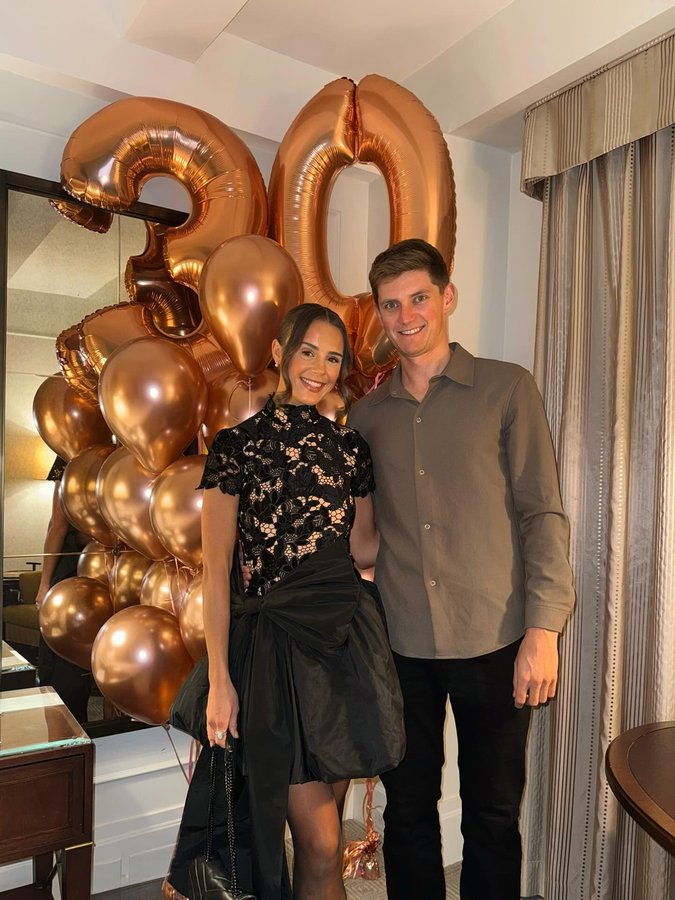 Instagram post by @whatemwore for Karen Millen. Caption reads: turned 30 in NYC 😭🥂🚕🗽.