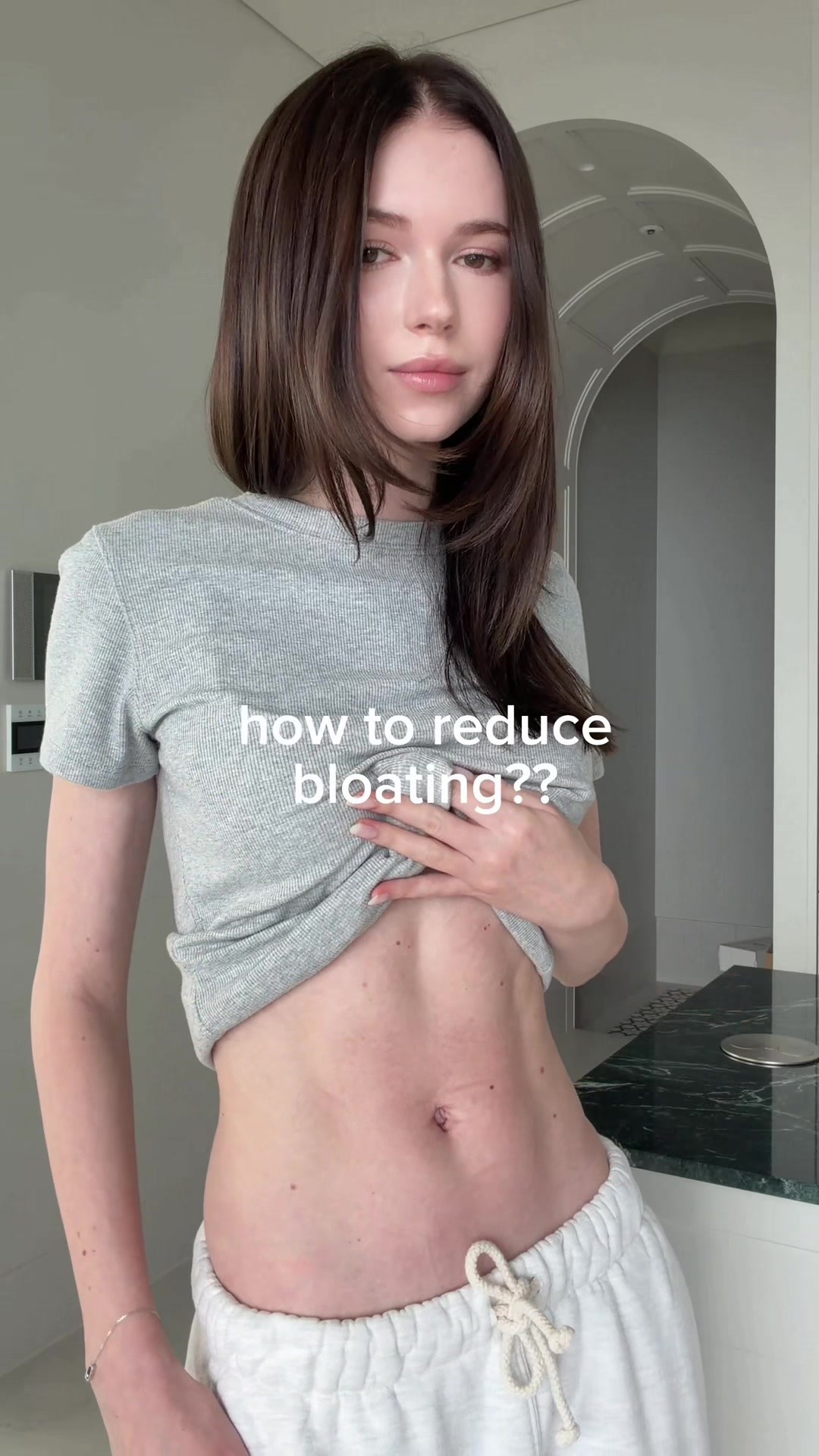 TikTok post by @whatislada for FOODOLOGY US. Caption reads: How to reduce bloating 🤍 AD @FOODOLOGY US....
