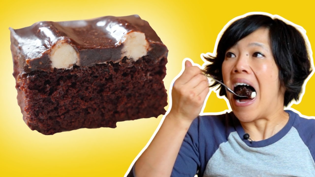 YouTube post by @emmymade for The Kitchn. Caption reads: Is This 100-Year-Old Chocolate Cake Recipe The....