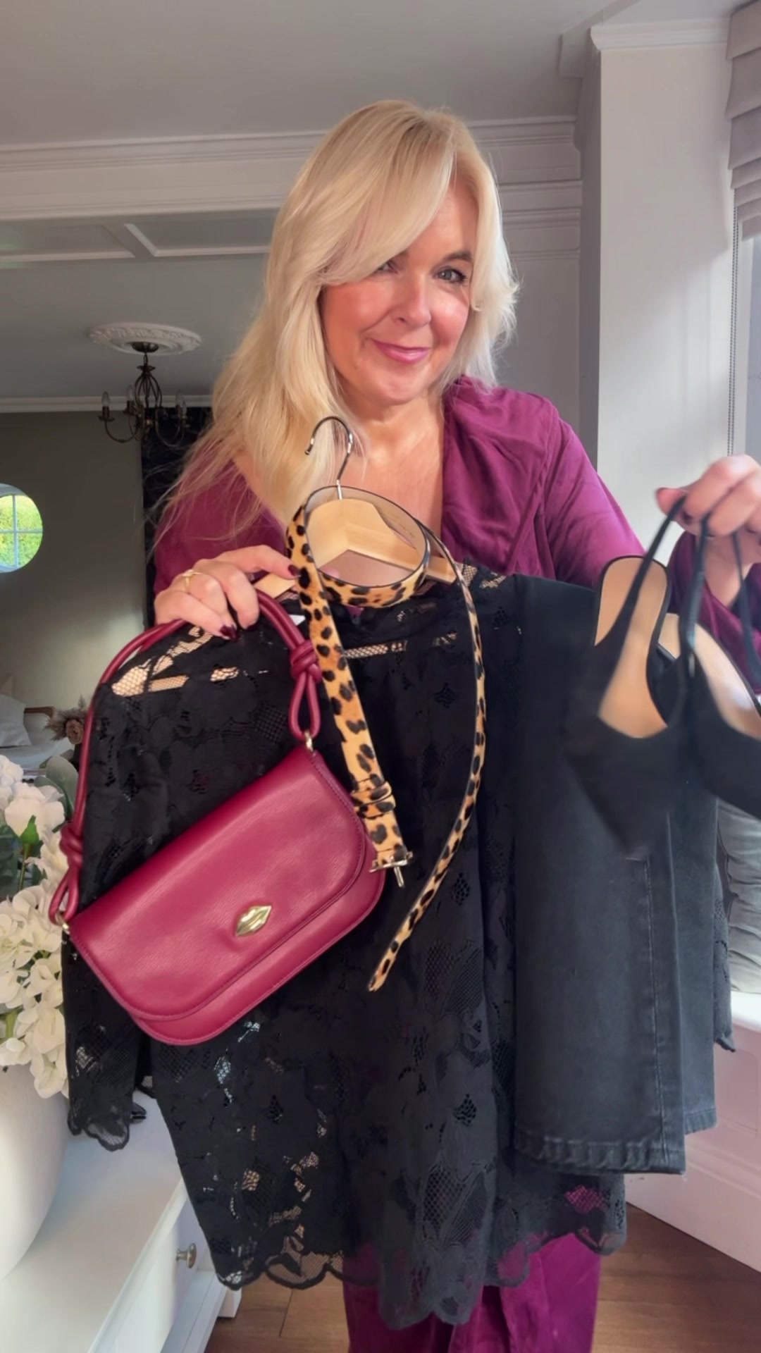 TikTok post by @lovestyle40 for Lulu Guinness. Caption reads: Date night look 🖤❤️ Top H&M Bag @Lulu Guinness....