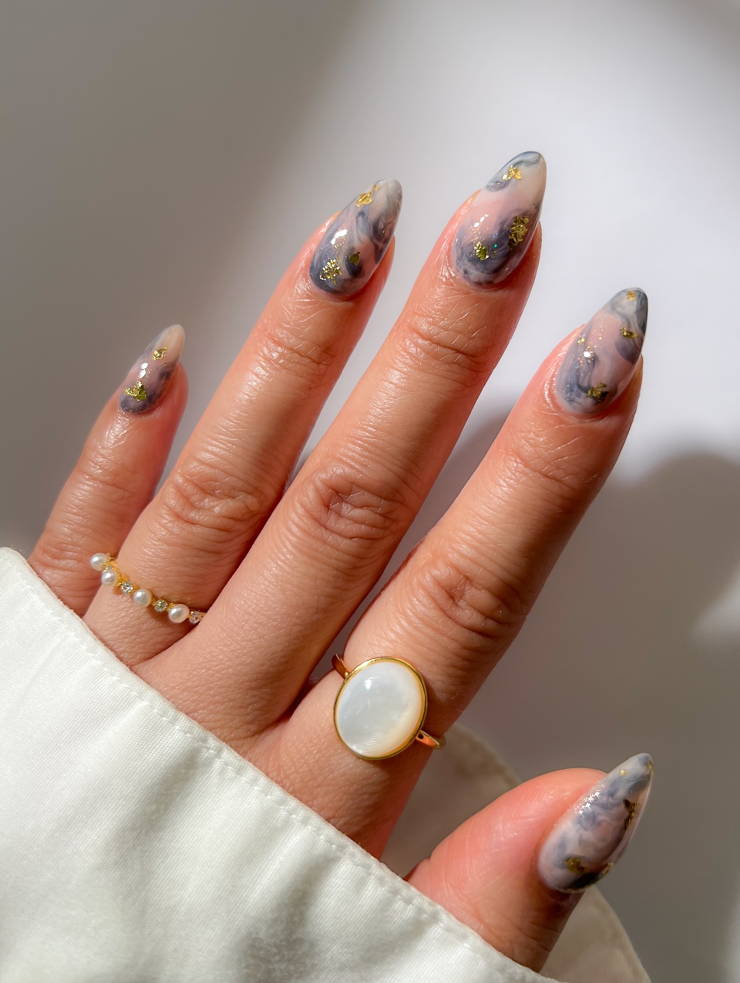 Instagram post by @mydumbnails for Caitlyn Minimalist. Caption reads: Smokey marble ✨ Used the new “Reach for the Sky”....