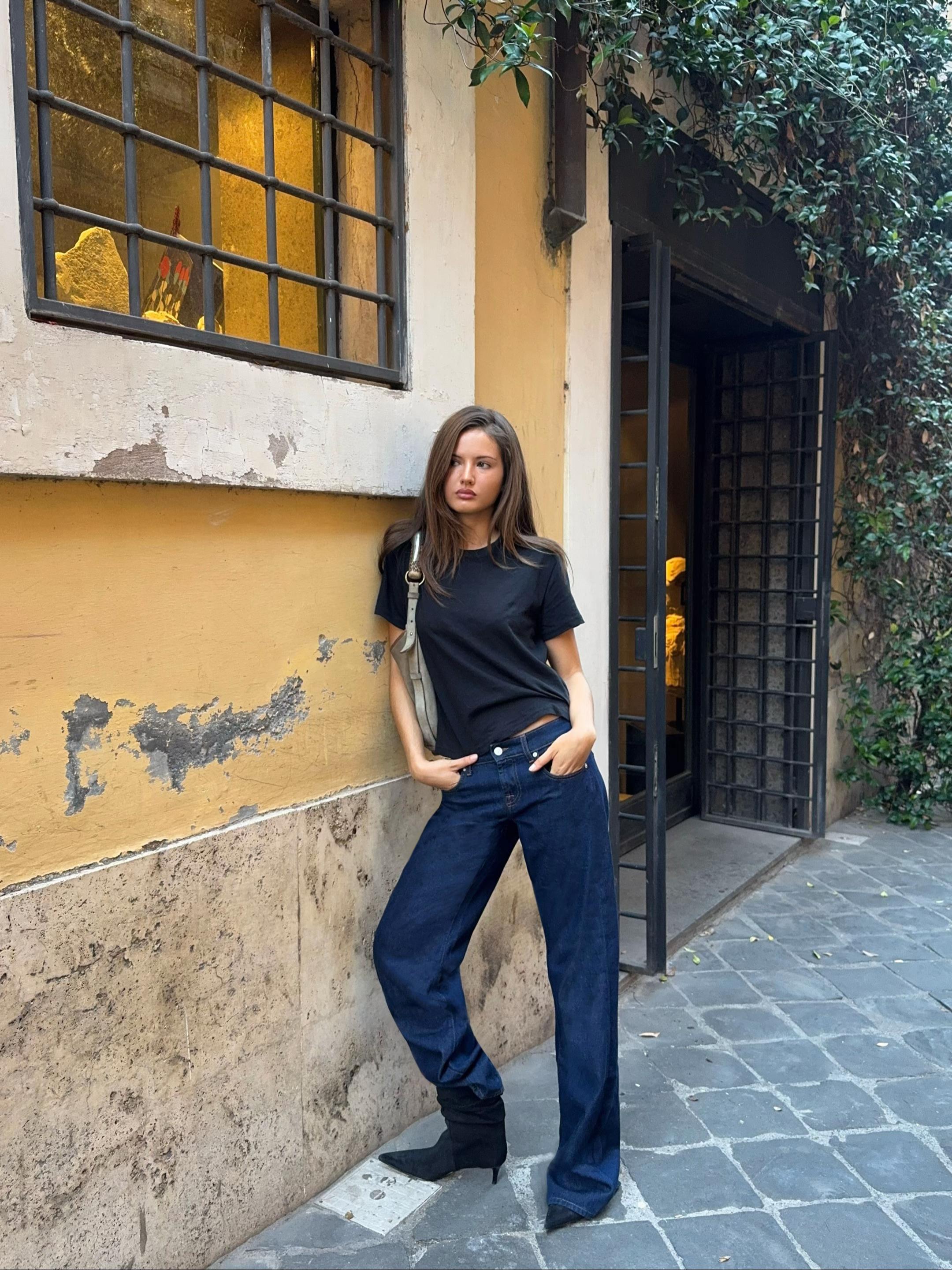 TikTok post by @rubylyn_ for 7 FOR ALL MANKIND. Caption reads: @7 For All Mankind in rome ft. the low straight....