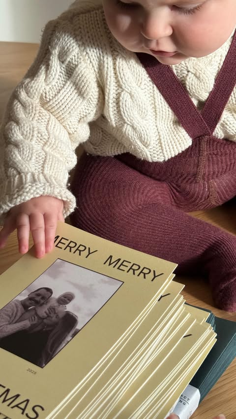 Instagram post by @rachaelalexaaandra for Artifact Uprising. Caption reads: [...] with our little holiday elf. ❤️....