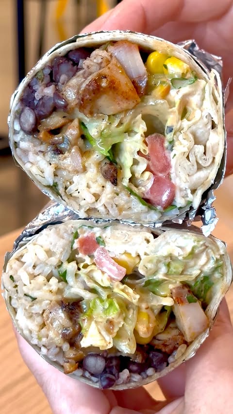 Instagram post by @chowbythebay for QDOBA. Caption reads: Rhode Island officially has its first @QDOBA! 🌯🙌....