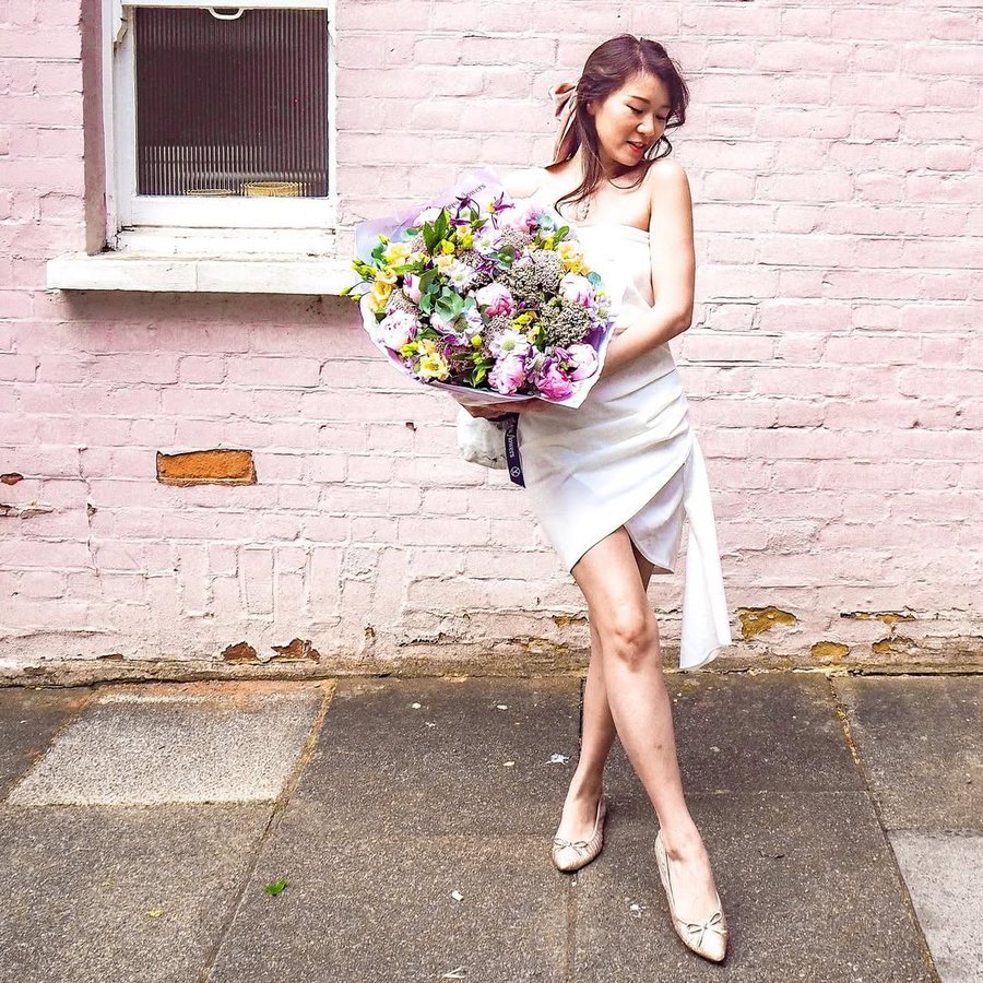 Instagram post by @jojohuaofficial for Arena Flowers. Caption reads: #ad Dreaming about things returning to normal....